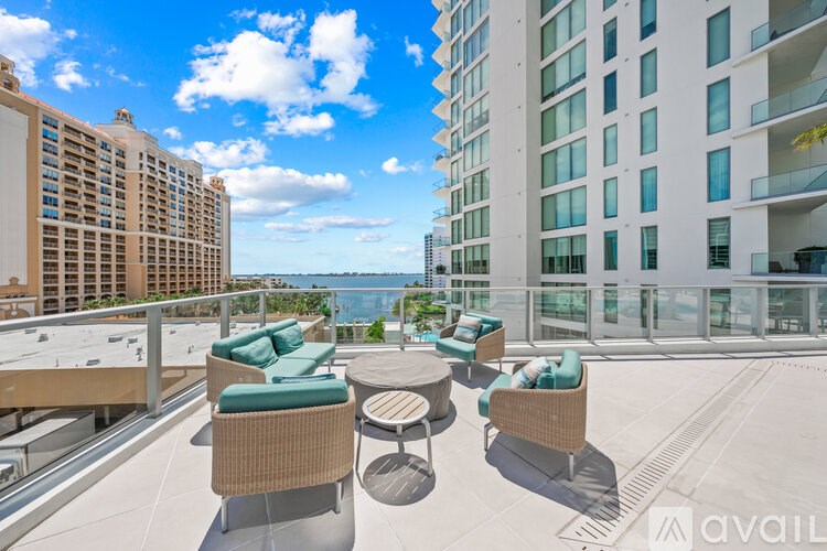 A patio with chairs and a table is available for rent.