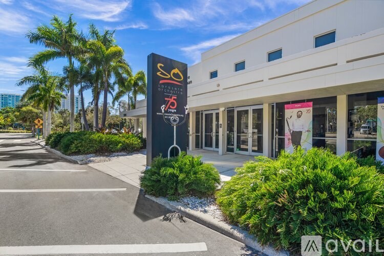 A building with a sign that says "SO" in front of it.