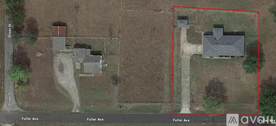 A satellite image shows a red outlined area with two buildings and a road.