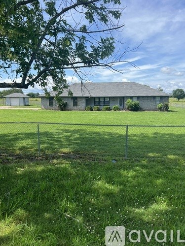 A house with a fence in front of it.