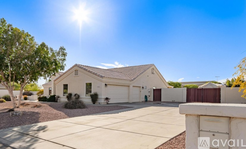A house with a sunny sky above it.