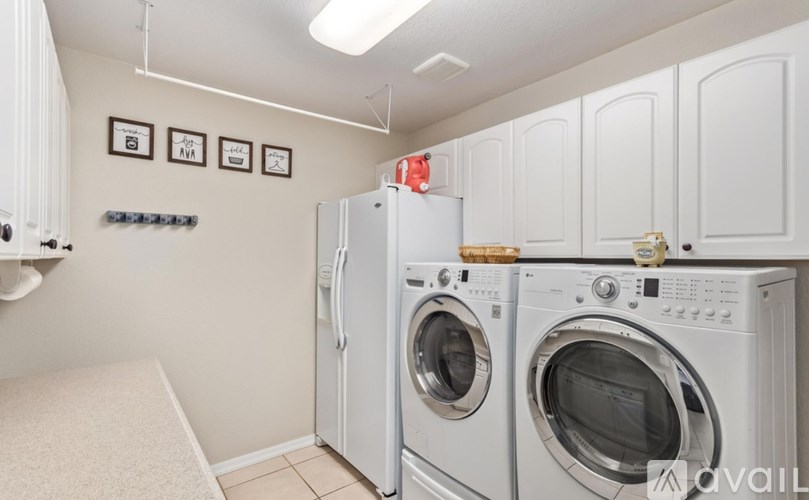 A laundry room with a washer and dryer.