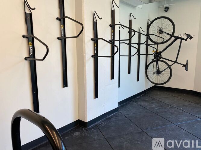 A wall of bike racks with bikes on them.