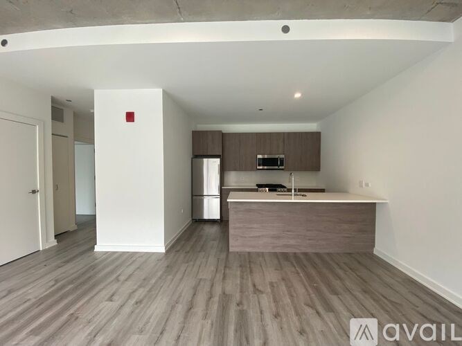 A kitchen area with a counter and cabinets.