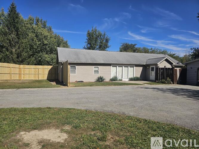 A house with a garage is available for sale.