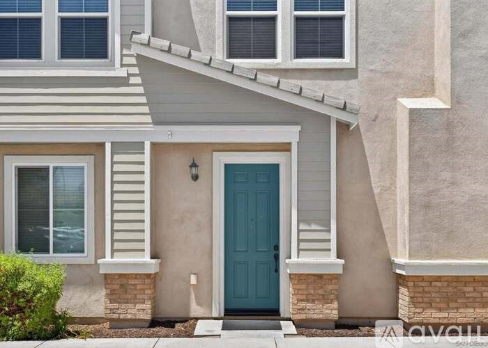 A house with a blue door and white trim.