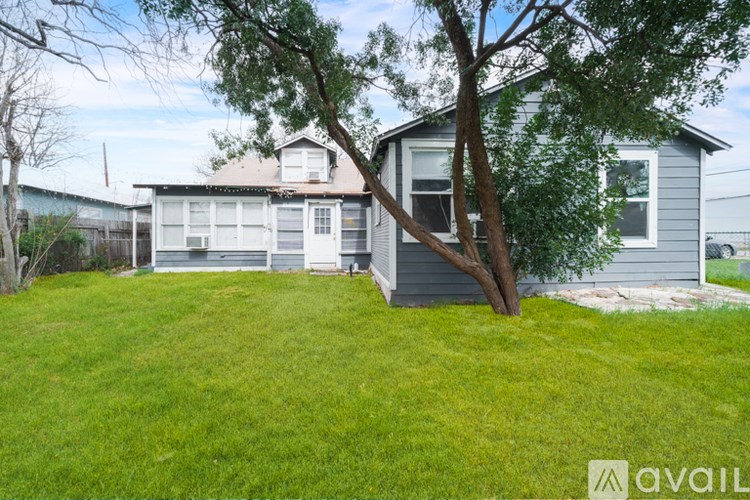A house with a tree in front of it.