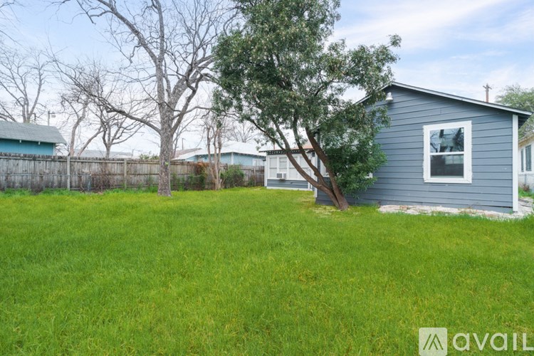 A house with a tree in front of it.