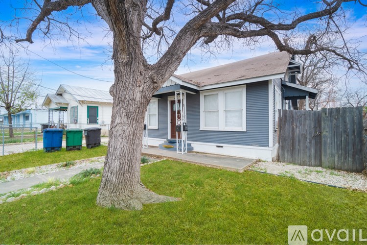 A house with a tree in front of it.
