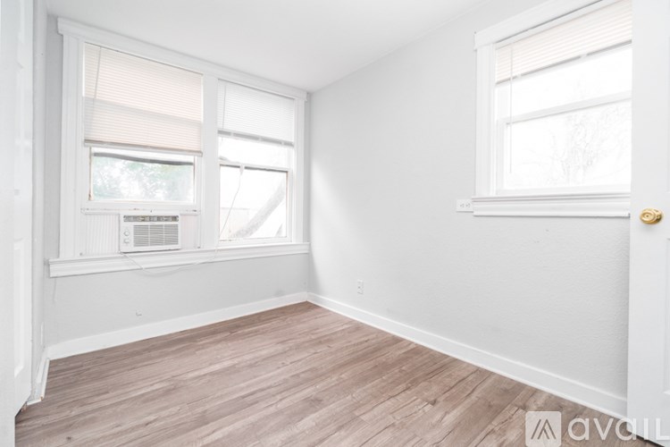 A room with a window and a door.