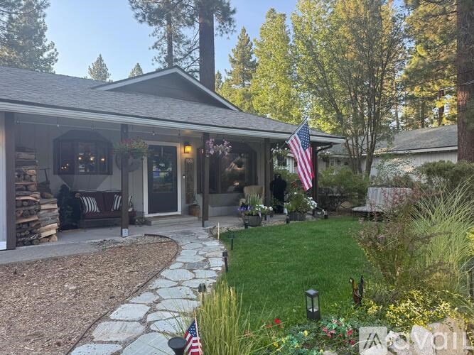 A house with a flag on the front porch.
