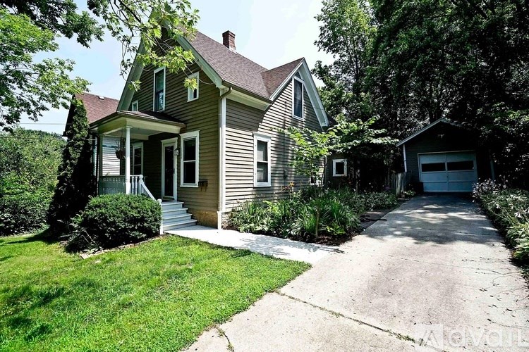 A house with a green front door and a garage.