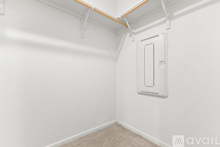 A white door with a handle is on the wall.