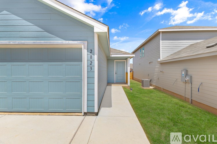 A blue garage door with the number 2 on it.