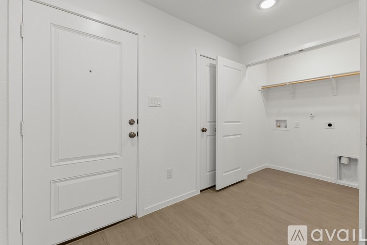 A white door with a round knob is on the left side of the image.