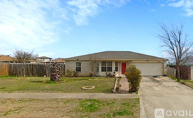 A house with a red door is for sale.