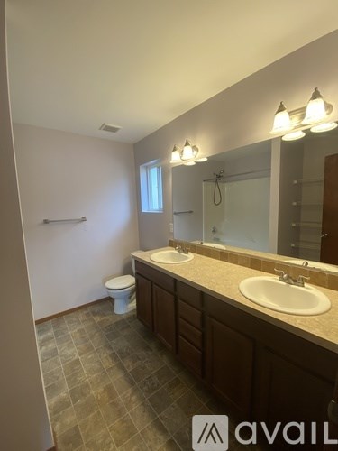 A room with a white door and a wooden table.