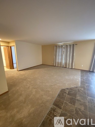 A bathroom with two sinks and a mirror.