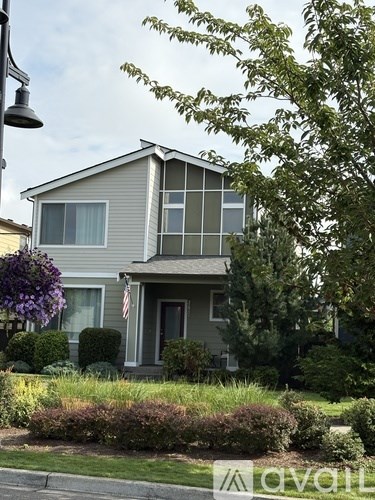 A house with a flag on the front porch.