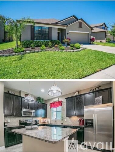 A modern house with a kitchen that has a granite countertop.