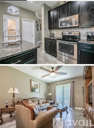 A kitchen with black cabinets and a stove top oven.