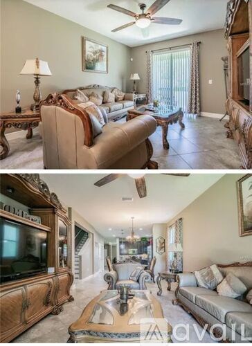 A living room with a couch, a coffee table, and a television.