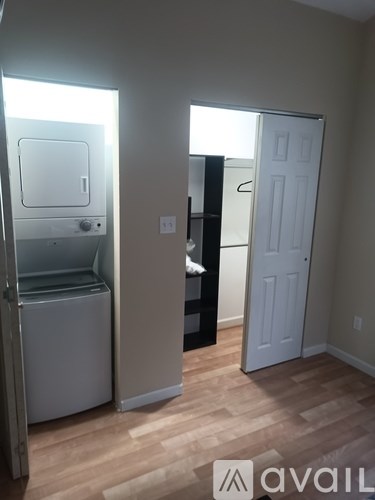 A small room with a washer and dryer in it.