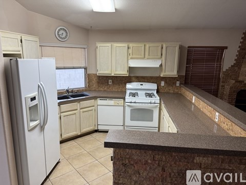 A kitchen with a white refrigerator and a white oven.
