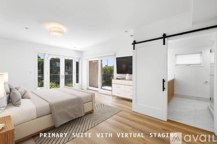 A bedroom with a bed, dresser, and sliding door leading to a balcony.
