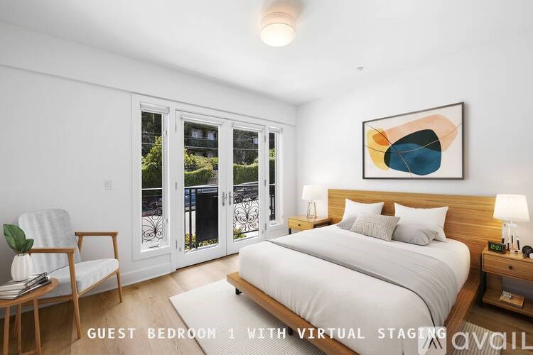 A guest bedroom with a bed, chair, and painting on the wall.