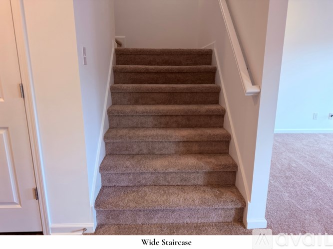 A white closet with a hanger on the rail.