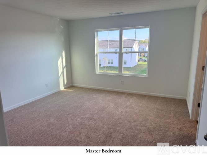 A staircase with beige carpeted steps and white railings.