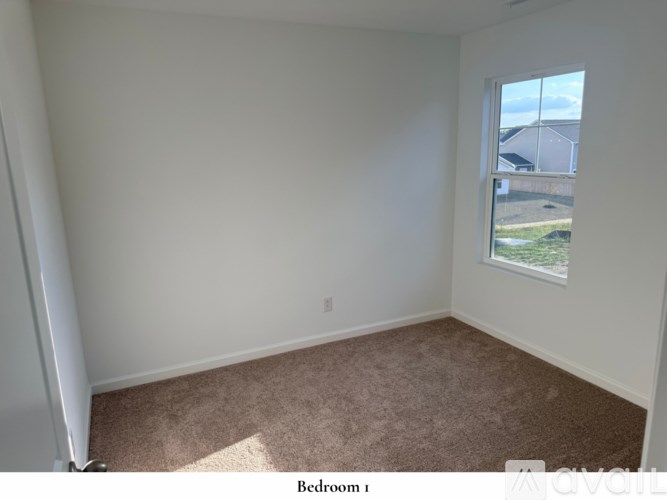 A bathroom with two sinks and a large mirror.