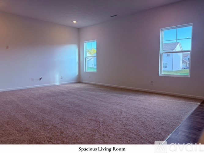 A kitchen with a white island and dark brown cabinets.