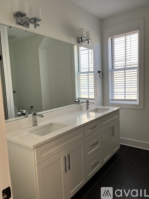A bathroom with a sink and mirror.