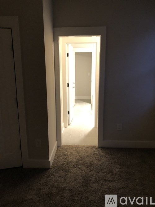 A hallway with a light at the end.
