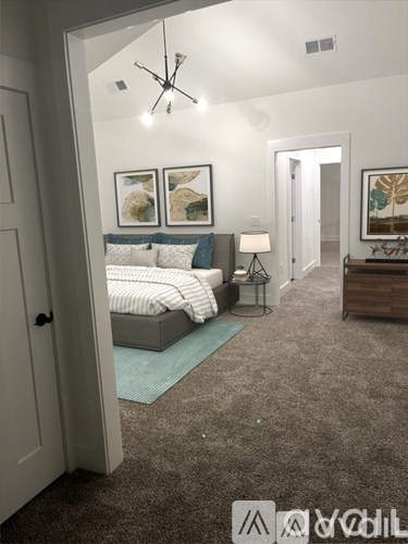 A bedroom with a bed, nightstand, and a rug.