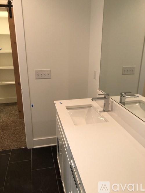 A bathroom with a sink and mirror.