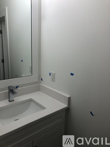 A bathroom sink with a mirror above it.