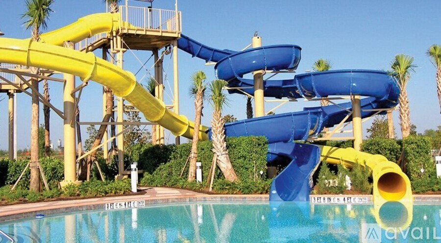 A water slide in a pool with a sign that says "available".