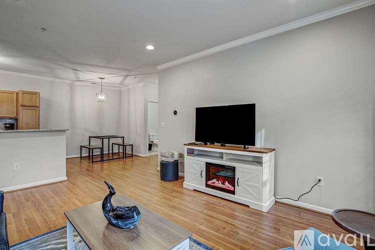 A living room with a television and a coffee table.