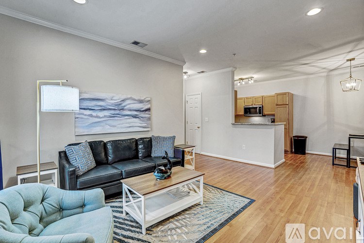 A living room with a couch, chair, and coffee table.