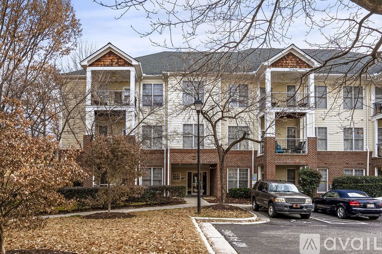 A building with a car parked in front of it.