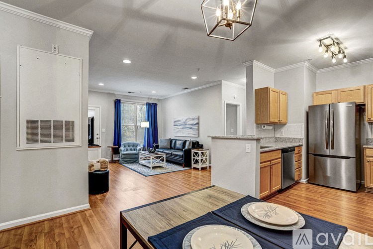 A modern kitchen with wooden cabinets and stainless steel appliances.