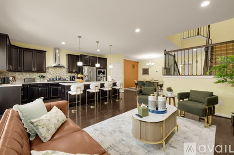 A living room with a brown leather couch and a coffee table.