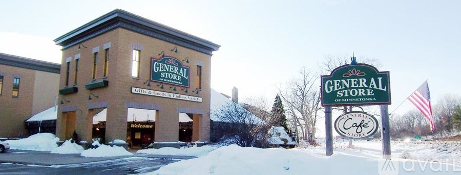A General Store building with a sign in front.