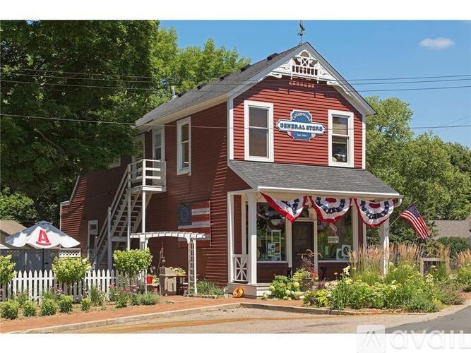 A red building with a sign that says "Overlander's Head" on it.