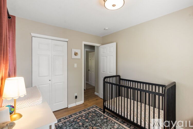 A baby's room with a crib and a dresser.