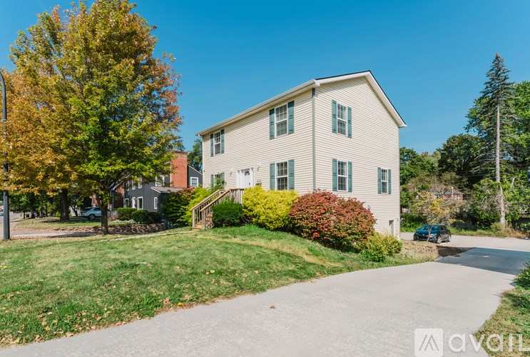 A house with a driveway in front of it.