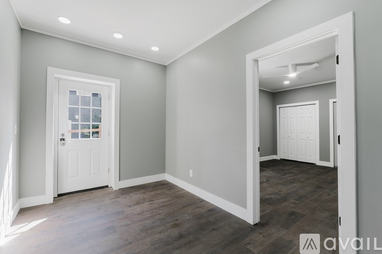 A room with a door and a window.